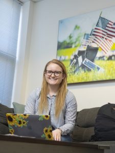 Student Veteran Katie Yetter smiling for a picture in an office