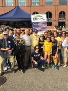 A group of M-SPAN staff members and supporters at UM Football game tailgate