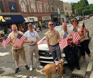 Picture of Buddy-to-Buddy volunteers and staff walking in the 4th of July Parade