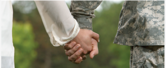 Photo of two hands holding--one of a woman's hand, the other hand that of a service member in uniform