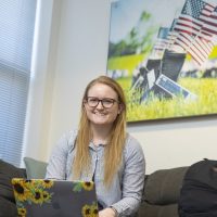 Student Veteran Katie Yetter smiling for a picture in an office