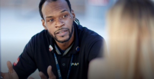 Photo of Rayshawn Williams talking with a student veteran