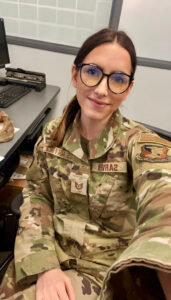 Person in glasses and a military uniform taking a selfie 