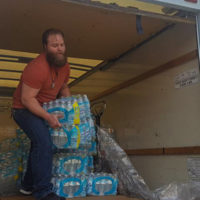 Last fall, the Student Veterans Organization collected supplies for victims of Hurricane Harvey. Marine Michael Bearth helped unload three pallets of water bottles to send to Houston