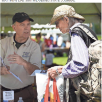 Ron Springer, left, of Buddy to Buddy, chats with USMC veteran Richard Begley during the 15th Annual Capital Area Stand Down for Homeless Veterans on Wednesday at Adado Riverfront Park in downtown Lansing. Buddy to Buddy is a volunteer program that does outreach and support for Michigan veterans. The event brings together services at a single location to provide resources for homeless veterans and those at risk of becoming homeless. More than 50 area agencies were in attendance to provide health screenings, shots, benefits enrollment, employment help, housing help and clothing. The event is put on by Volunteers of America Michigan in partnership with the U.S. Department of Veteran Affairs.