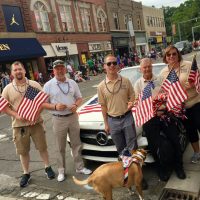 Picture of Buddy-to-Buddy volunteers and staff walking in the 4th of July Parade