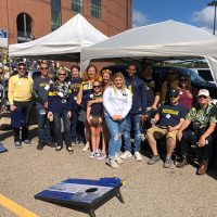 Group photo of M-SPAN friends and staff at 2019 UM Football Military Appreciation Game tailgate